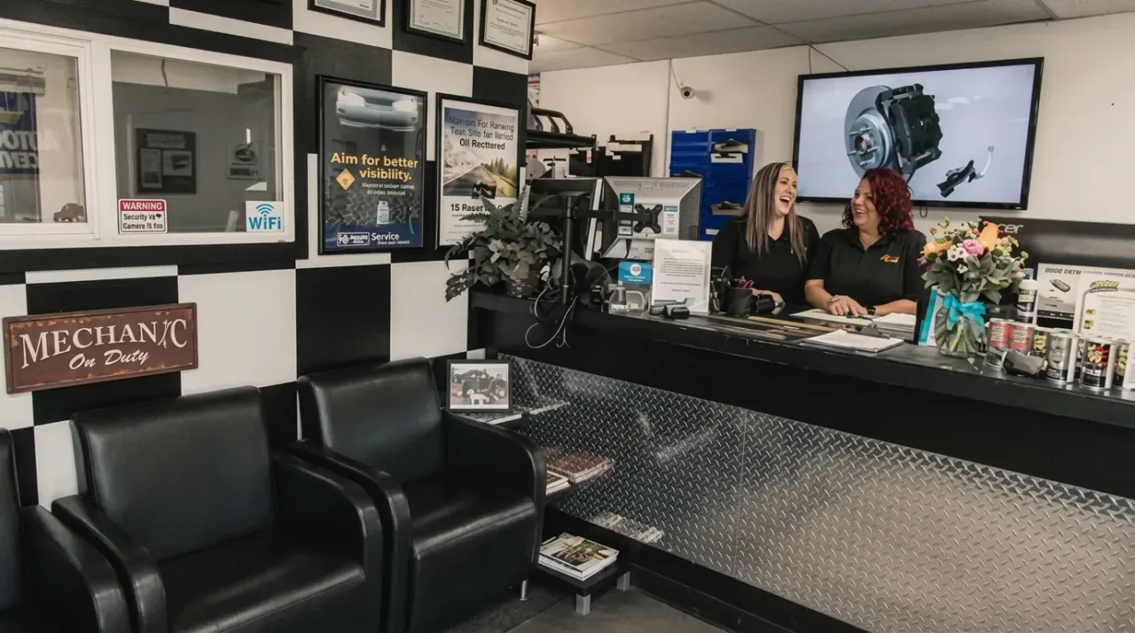Legacy Automotive service advisors at the front desk in the Boulder shop